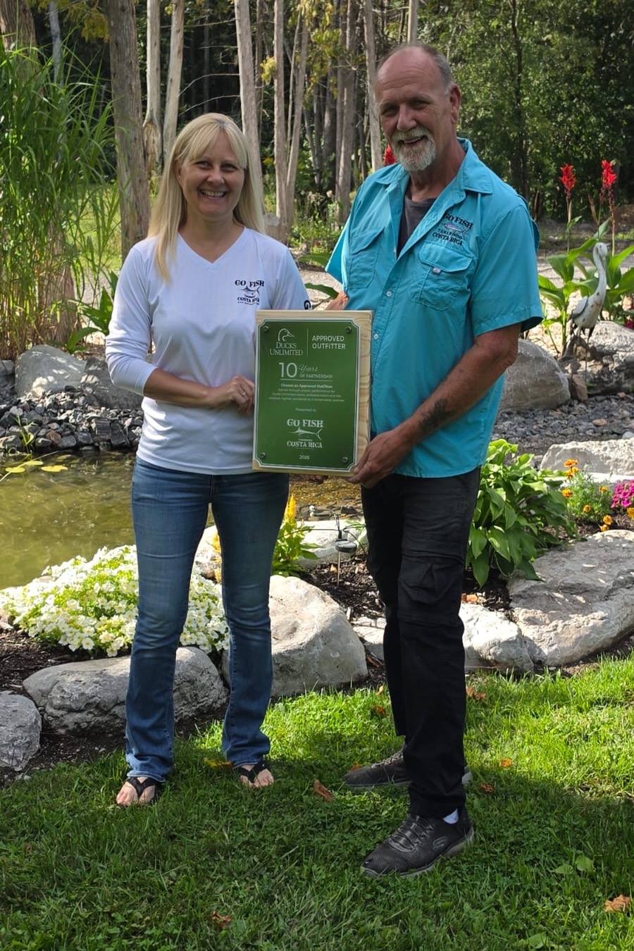 Steve and Liisa Quinn receiving the Ducks Unlimited ten-year Approved Outfitter award